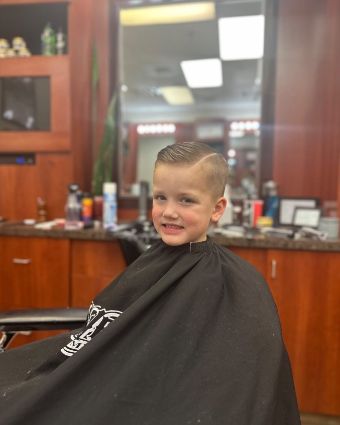 boy in barbers chair