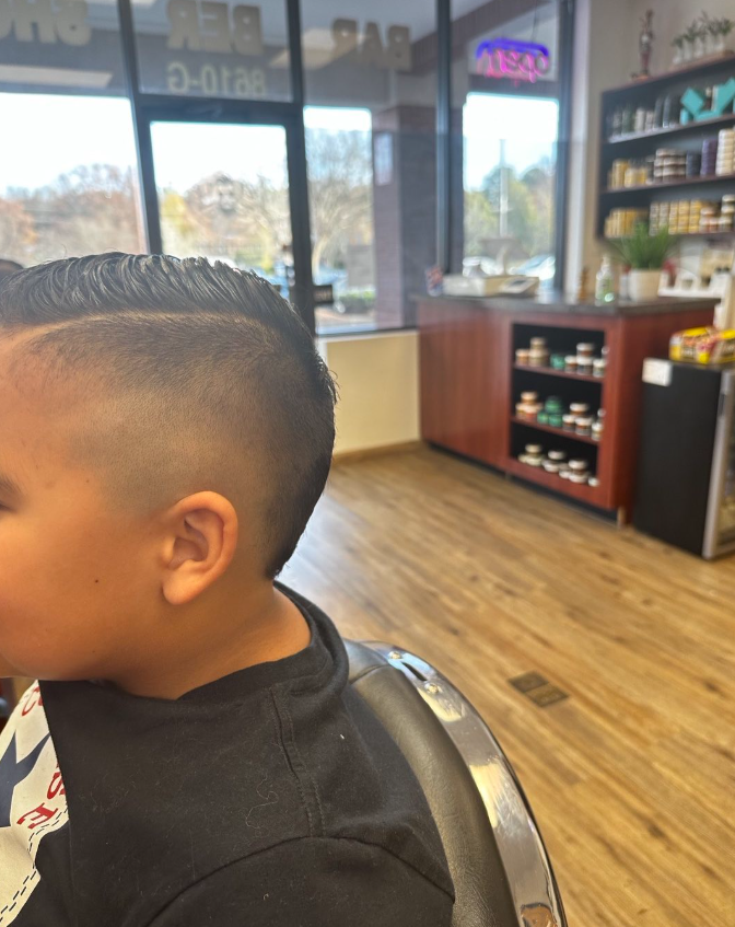 boy in barbers chair