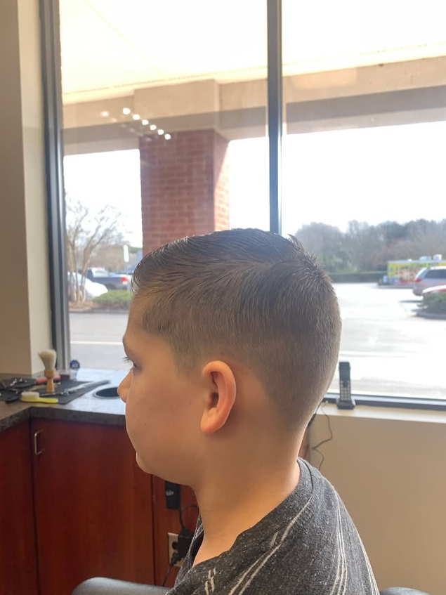 boy in barbers chair