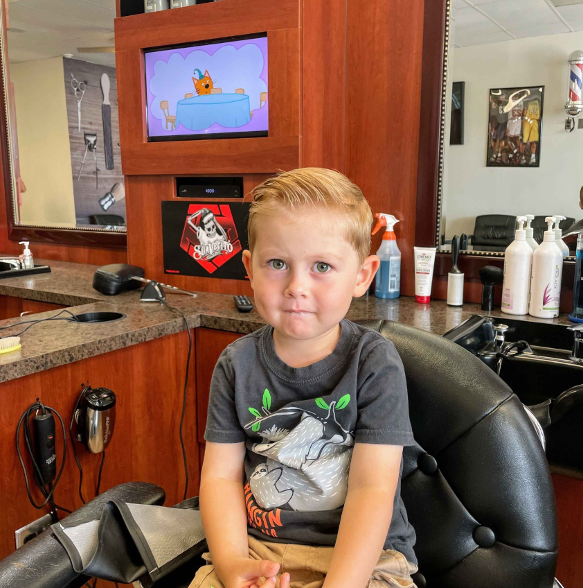 kid in barbershop chair